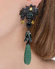 skull earrings with green pendents